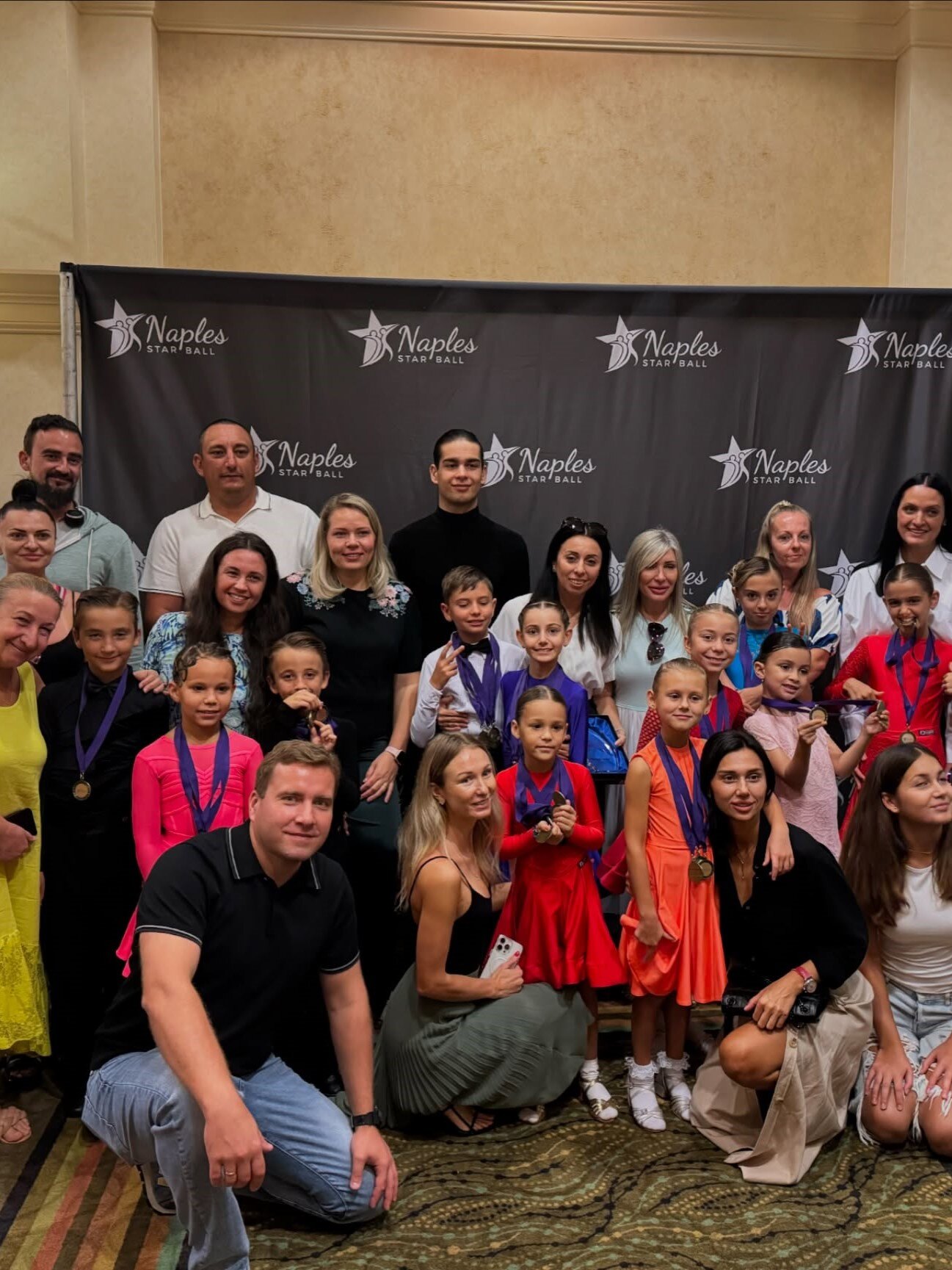 Young dancers together with their teachers
